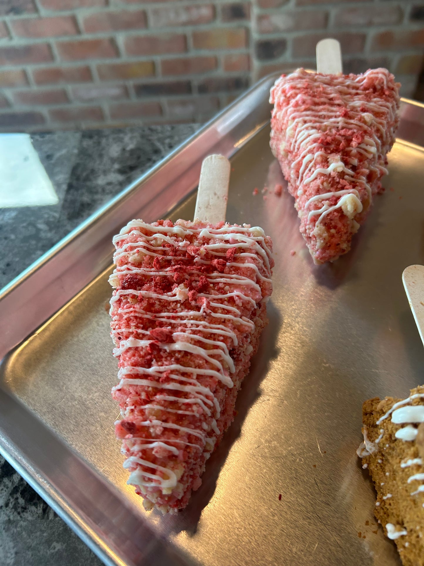 1 Large New York Style Slice Strawberry Crunch- Chocolate covered Cheesecake on a stick