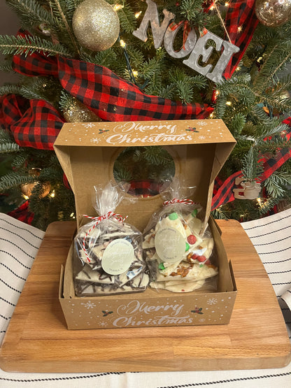 (2bags) 1 bag of each Chocolate Peppermint Bark and White Chocolate M&M and Pretzel bark in a Christmas Box