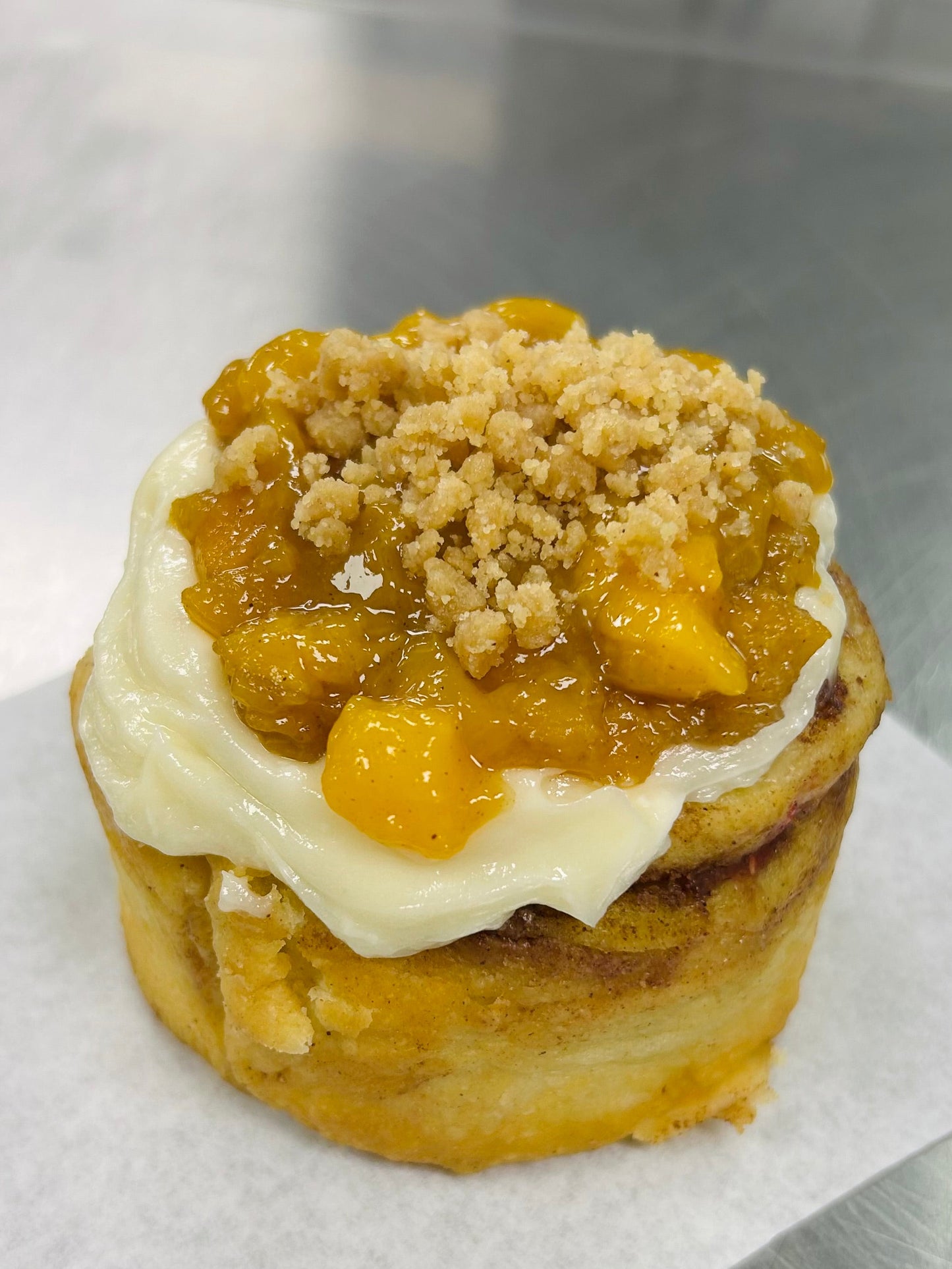 Professor Sheldon’s Peaches and Cream Cinnamon Roll