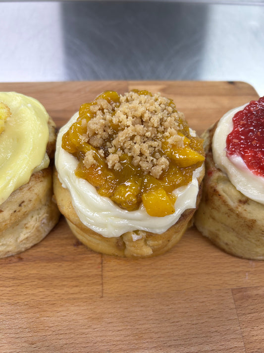Professor Sheldon’s Peaches and Cream Cinnamon Roll