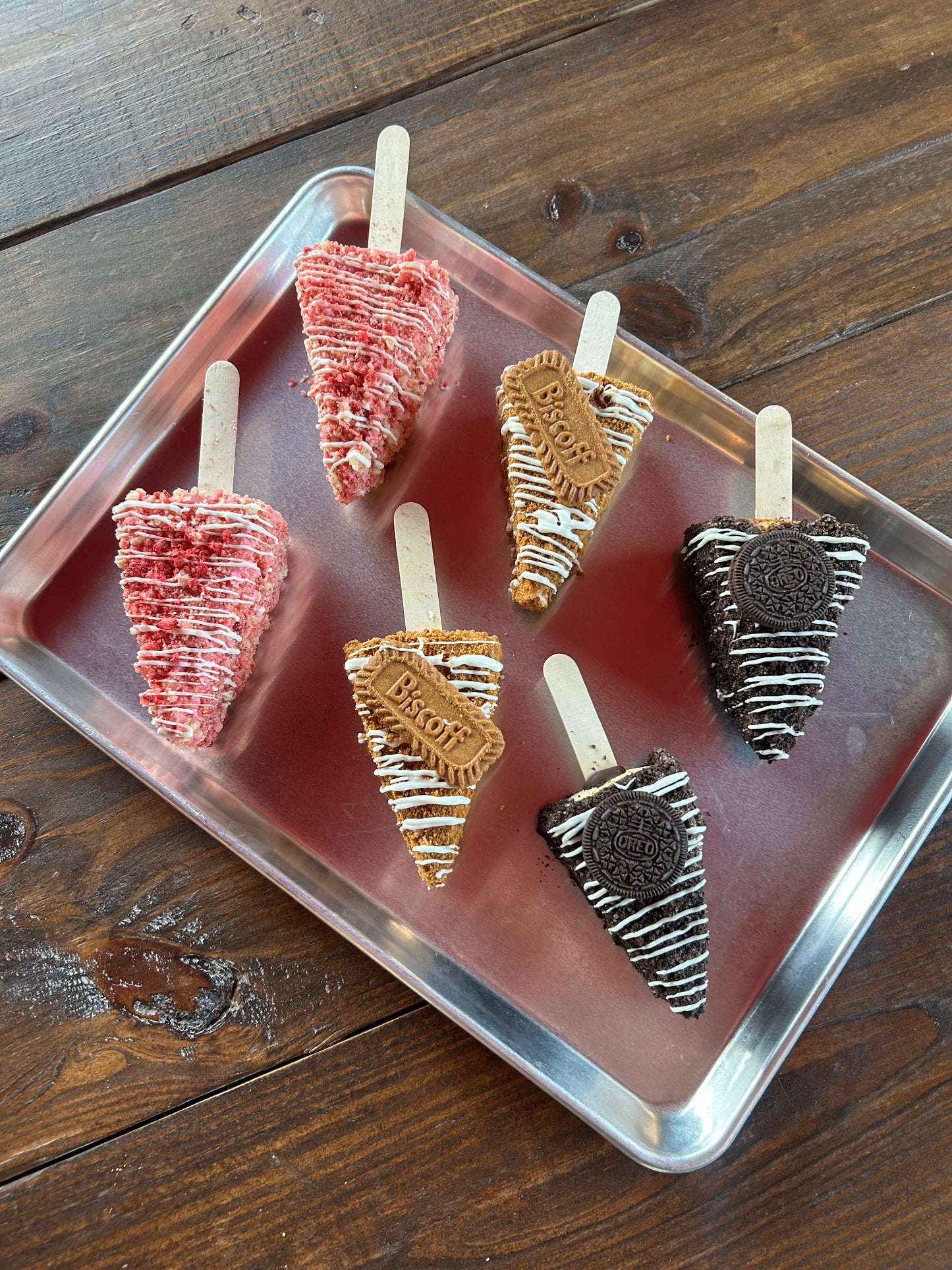 1 Large New York Style Slice Strawberry Crunch- Chocolate covered Cheesecake on a stick